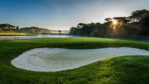 PGA Catalunya 3rd hole with hole 11 across the lake